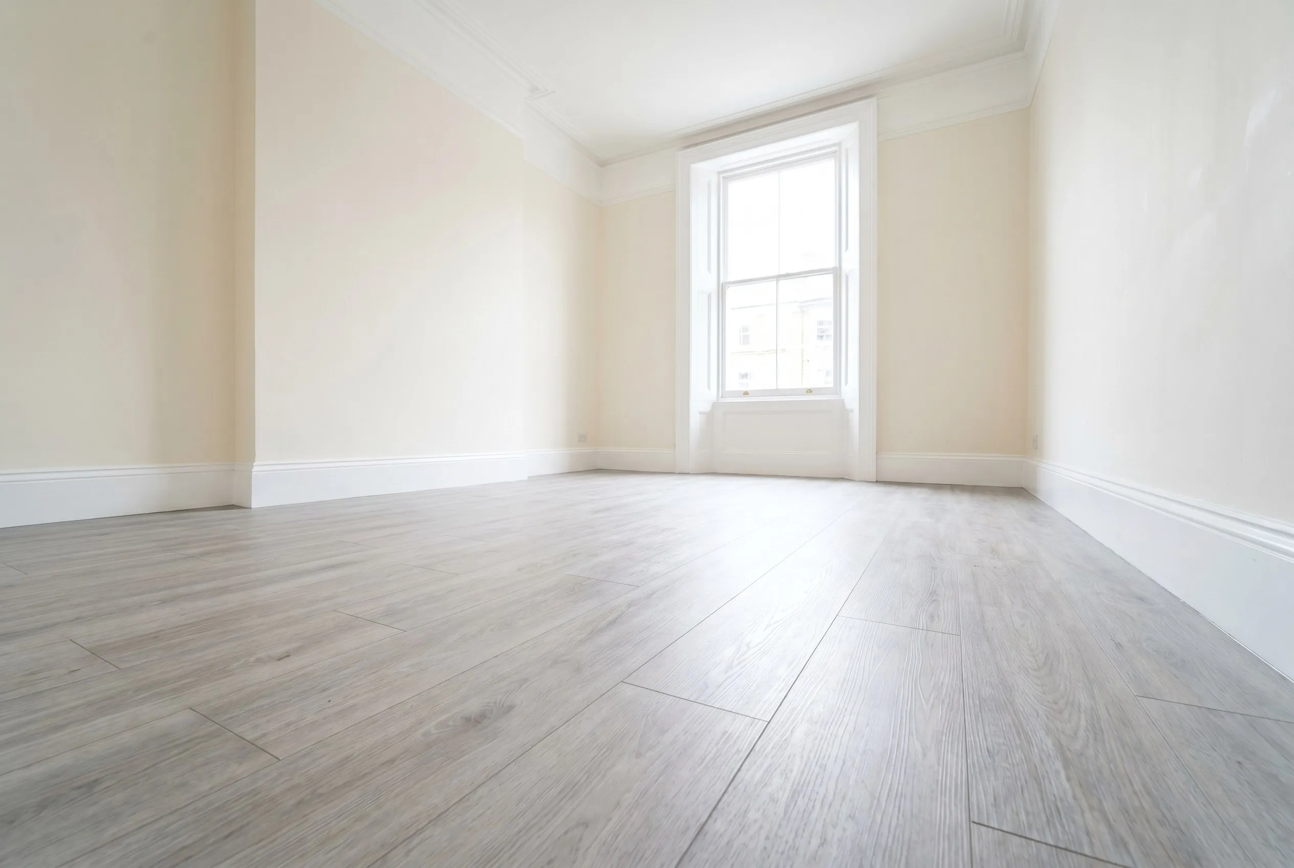Finished oak-effect LVT floor in a London property by Ferizi