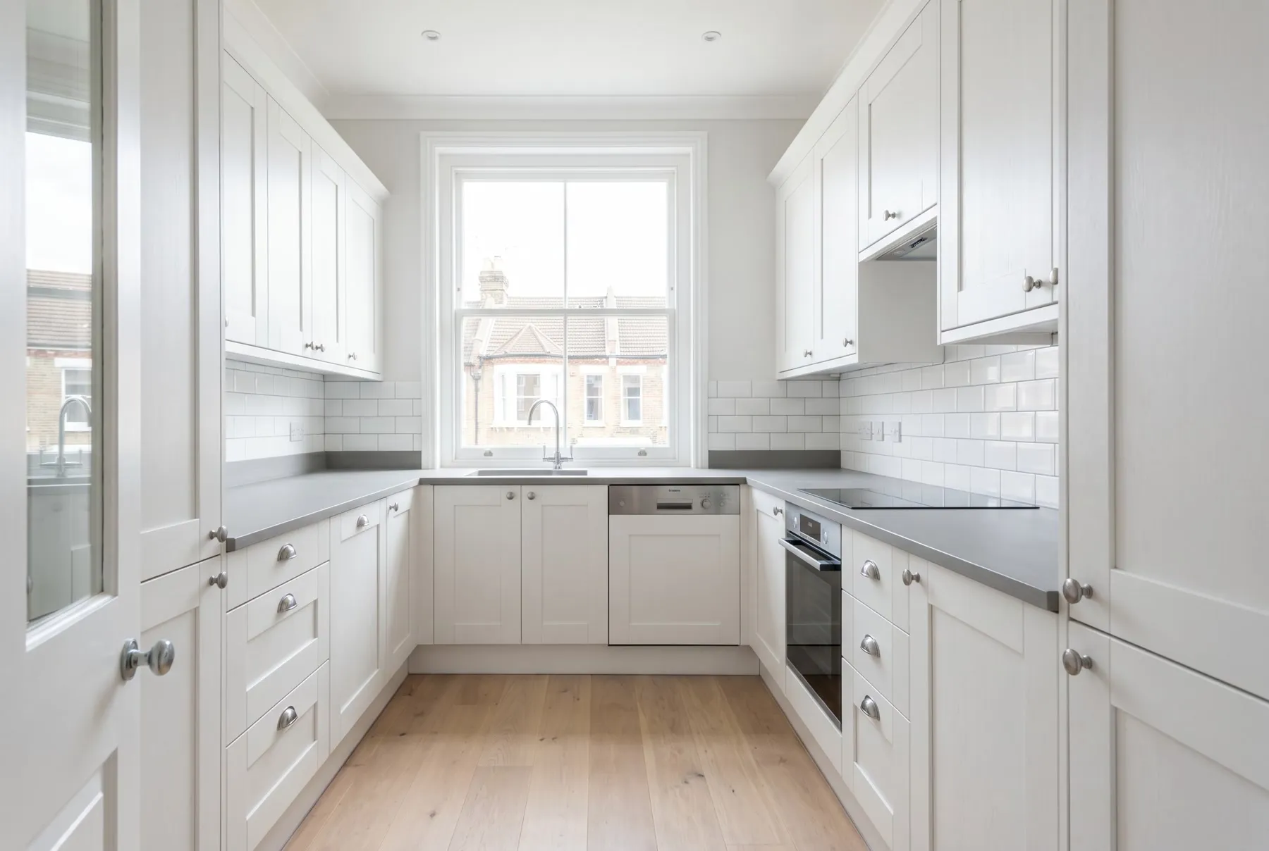 Completed full kitchen renovation with new units, worktops and tiling in a London property by Ferizi Property Services