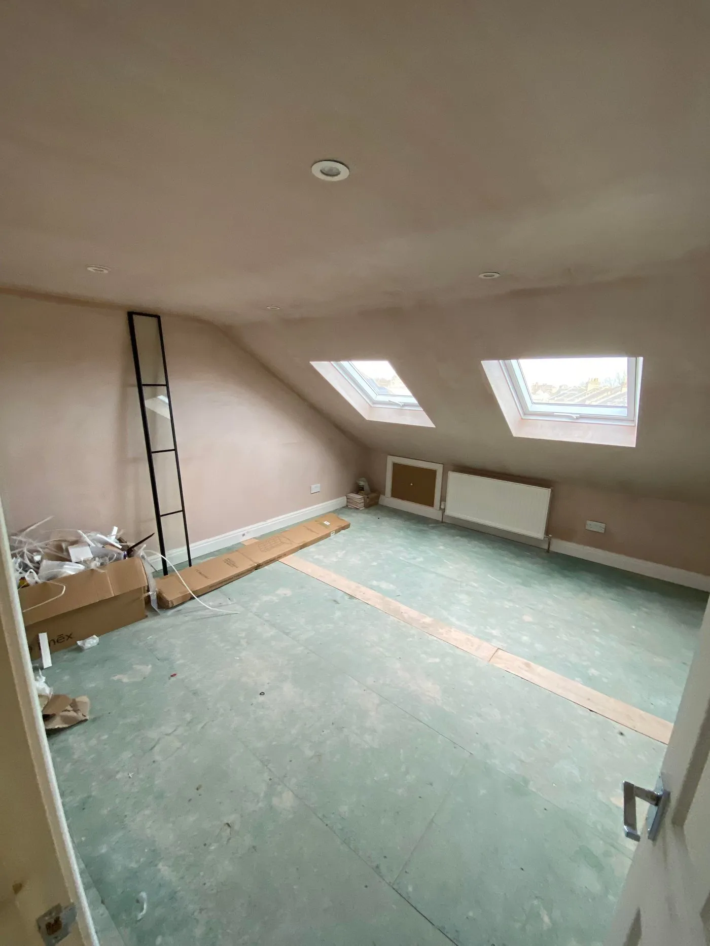 Loft room with skylights, London property refurbishment by Ferizi
